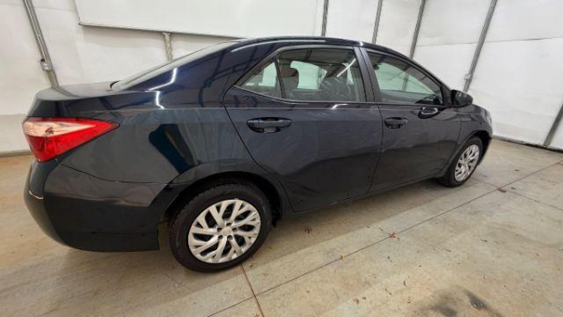 2018 Blue Toyota Corolla LE (5YFBURHE2JP) with an 1.8L I-4 DOHC engine, located at 1806 Veterans Memorial Hwy SW, Austell, GA, 30168, (770) 944-9558, 33.817959, -84.606987 - Photo#7