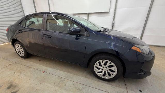 2018 Blue Toyota Corolla LE (5YFBURHE2JP) with an 1.8L I-4 DOHC engine, located at 1806 Veterans Memorial Hwy SW, Austell, GA, 30168, (770) 944-9558, 33.817959, -84.606987 - Photo#8