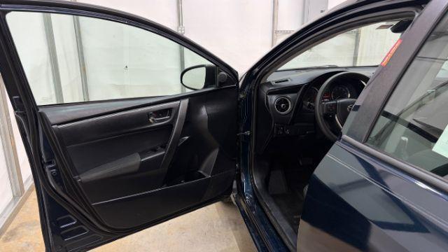 2018 Blue Toyota Corolla LE (5YFBURHE2JP) with an 1.8L I-4 DOHC engine, located at 1806 Veterans Memorial Hwy SW, Austell, GA, 30168, (770) 944-9558, 33.817959, -84.606987 - Photo#11