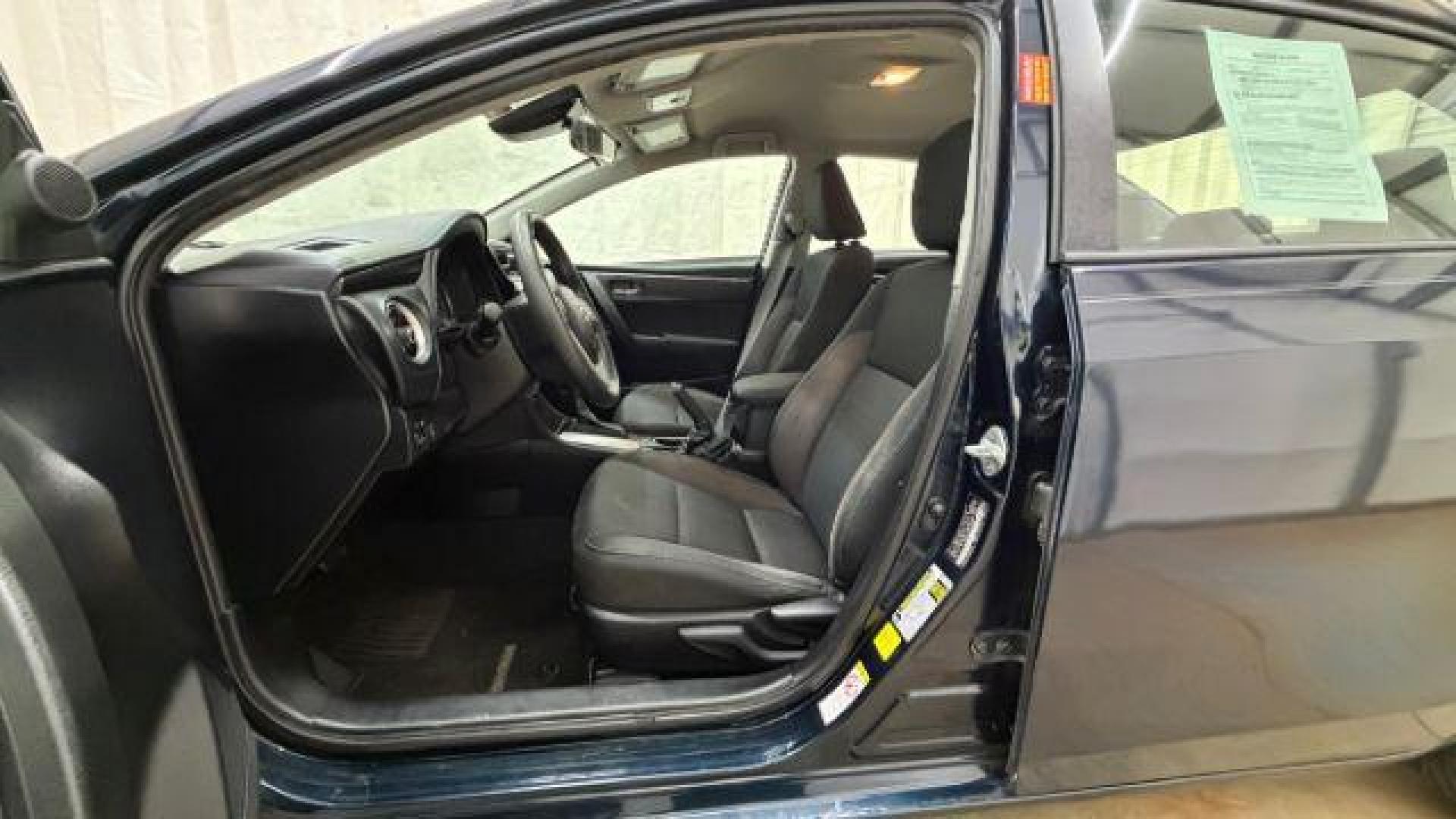 2018 Blue Toyota Corolla LE (5YFBURHE2JP) with an 1.8L I-4 DOHC engine, located at 1806 Veterans Memorial Hwy SW, Austell, GA, 30168, (770) 944-9558, 33.817959, -84.606987 - Photo#13