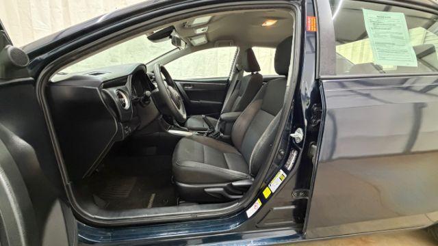 2018 Blue Toyota Corolla LE (5YFBURHE2JP) with an 1.8L I-4 DOHC engine, located at 1806 Veterans Memorial Hwy SW, Austell, GA, 30168, (770) 944-9558, 33.817959, -84.606987 - Photo#13