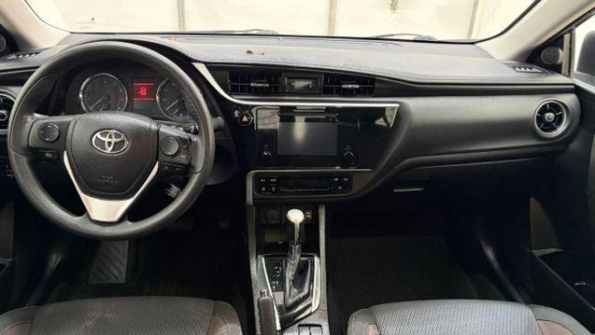 2018 Blue Toyota Corolla LE (5YFBURHE2JP) with an 1.8L I-4 DOHC engine, located at 1806 Veterans Memorial Hwy SW, Austell, GA, 30168, (770) 944-9558, 33.817959, -84.606987 - Photo#16