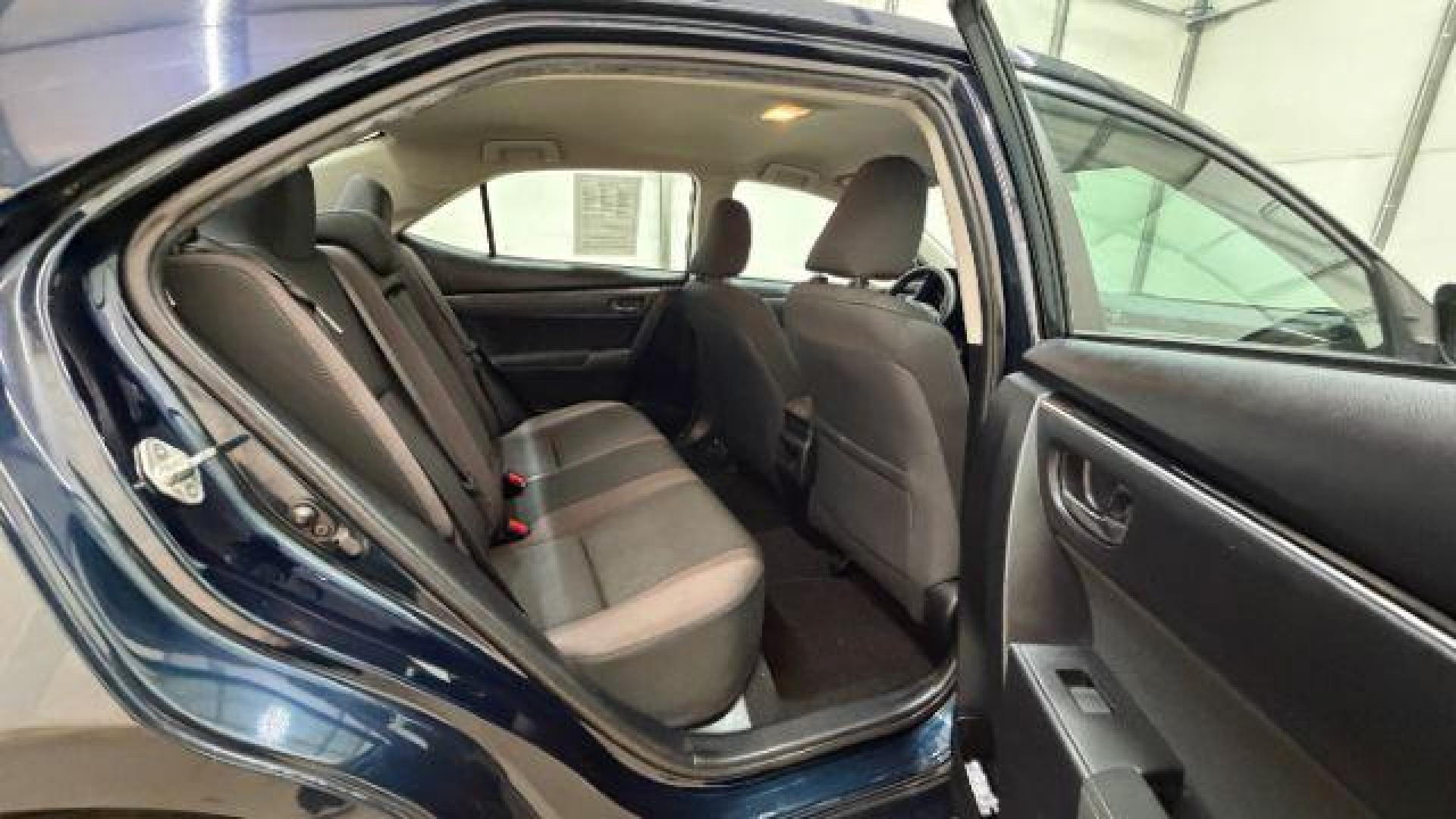 2018 Blue Toyota Corolla LE (5YFBURHE2JP) with an 1.8L I-4 DOHC engine, located at 1806 Veterans Memorial Hwy SW, Austell, GA, 30168, (770) 944-9558, 33.817959, -84.606987 - Photo#17