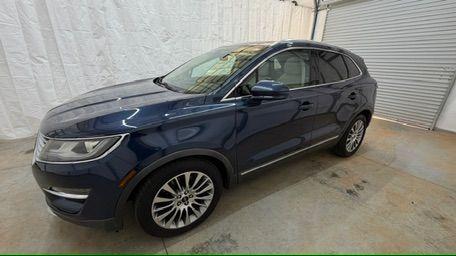 2015 Blue Lincoln MKC . (5LMCJ1A97FU) with an 2.0L engine, located at 1806 Veterans Memorial Hwy SW, Austell, GA, 30168, (770) 944-9558, 33.817959, -84.606987 - Photo#1
