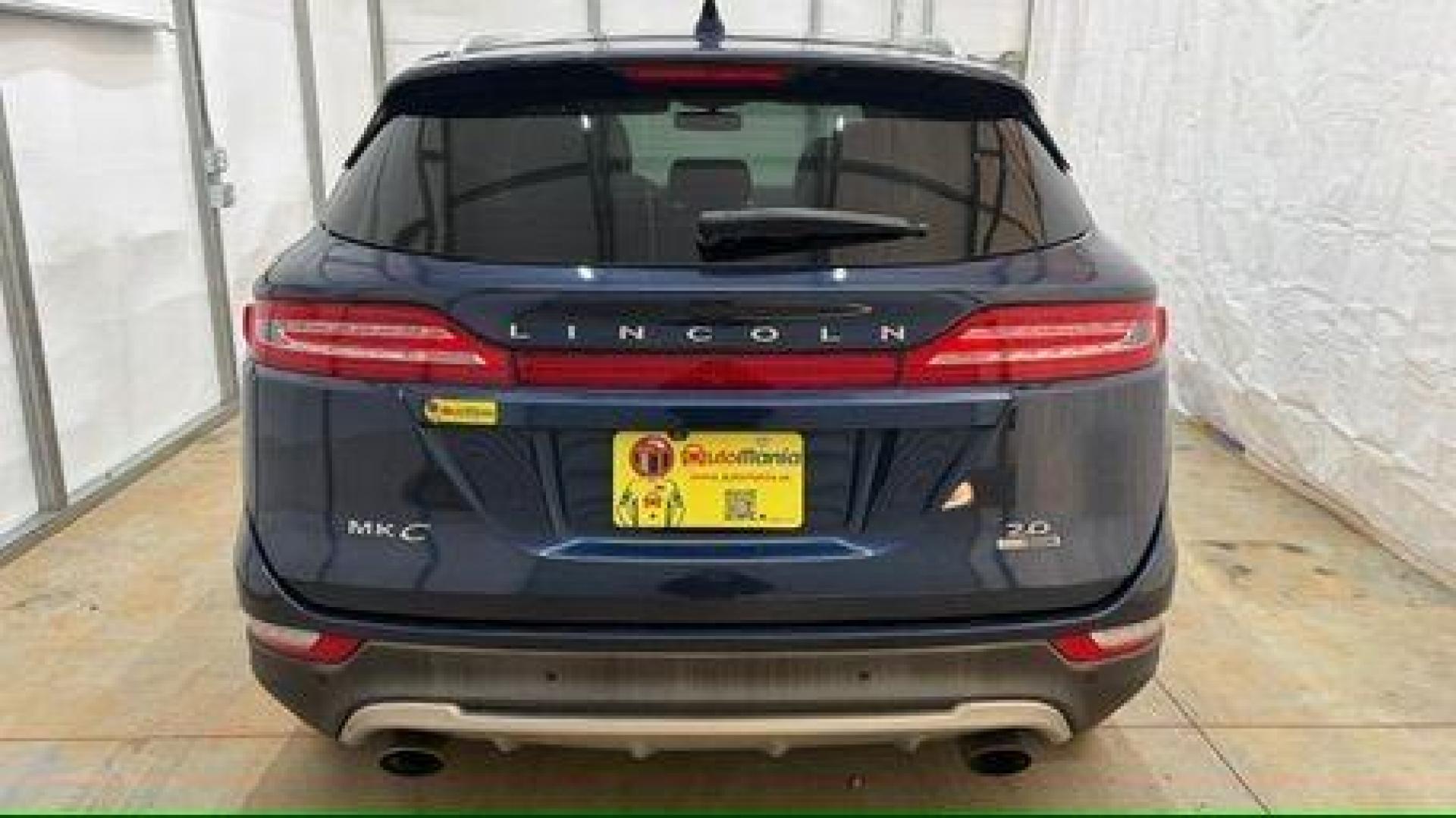 2015 Blue Lincoln MKC . (5LMCJ1A97FU) with an 2.0L engine, located at 1806 Veterans Memorial Hwy SW, Austell, GA, 30168, (770) 944-9558, 33.817959, -84.606987 - Photo#4