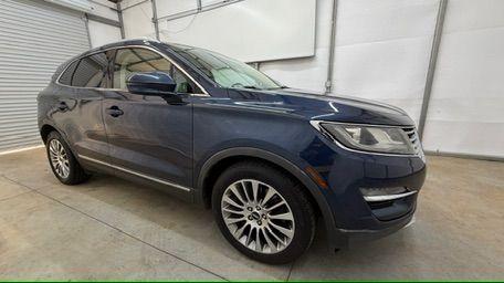 2015 Blue Lincoln MKC . (5LMCJ1A97FU) with an 2.0L engine, located at 1806 Veterans Memorial Hwy SW, Austell, GA, 30168, (770) 944-9558, 33.817959, -84.606987 - Photo#7