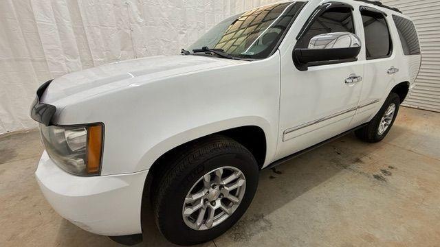 2011 White Chevrolet Tahoe LTZ (1GNSCCE0XBR) with an Vortec 5.3L V-8 variable valve control engine, located at 1806 Veterans Memorial Hwy SW, Austell, GA, 30168, (770) 944-9558, 33.817959, -84.606987 - Photo#1