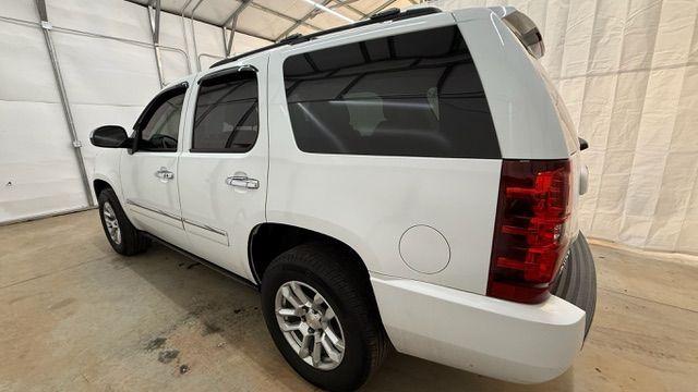 2011 White Chevrolet Tahoe LTZ (1GNSCCE0XBR) with an Vortec 5.3L V-8 variable valve control engine, located at 1806 Veterans Memorial Hwy SW, Austell, GA, 30168, (770) 944-9558, 33.817959, -84.606987 - Photo#2