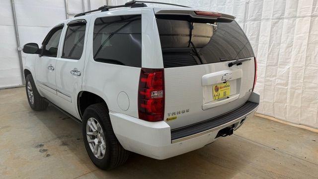 2011 White Chevrolet Tahoe LTZ (1GNSCCE0XBR) with an Vortec 5.3L V-8 variable valve control engine, located at 1806 Veterans Memorial Hwy SW, Austell, GA, 30168, (770) 944-9558, 33.817959, -84.606987 - Photo#3