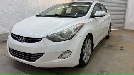 2013 White Hyundai Elantra Limited (5NPDH4AE2DH) with an 1.8L I-4 DOHC engine, located at 1806 Veterans Memorial Hwy SW, Austell, GA, 30168, (770) 944-9558, 33.817959, -84.606987 - Photo#0