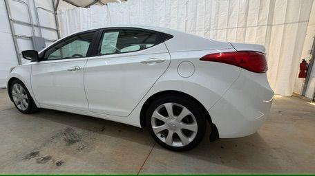 2013 White Hyundai Elantra Limited (5NPDH4AE2DH) with an 1.8L I-4 DOHC engine, located at 1806 Veterans Memorial Hwy SW, Austell, GA, 30168, (770) 944-9558, 33.817959, -84.606987 - Photo#2