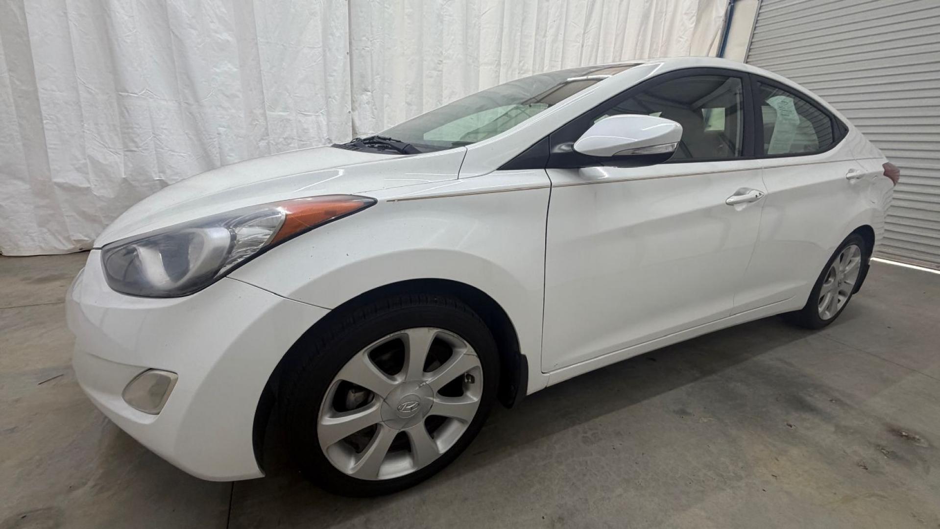 2013 White Hyundai Elantra Limited (5NPDH4AE2DH) with an 1.8L I-4 DOHC engine, located at 1806 Veterans Memorial Hwy SW, Austell, GA, 30168, (770) 944-9558, 33.817959, -84.606987- Photo#1