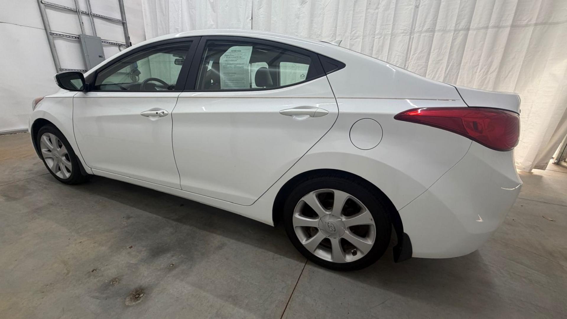 2013 White Hyundai Elantra Limited (5NPDH4AE2DH) with an 1.8L I-4 DOHC engine, located at 1806 Veterans Memorial Hwy SW, Austell, GA, 30168, (770) 944-9558, 33.817959, -84.606987- Photo#2