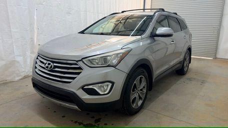 2014 Silver Hyundai Santa Fe GLS (KM8SN4HF3EU) with an Lambda II 3.3L V-6 gasoline direct injection engine, located at 1806 Veterans Memorial Hwy SW, Austell, GA, 30168, (770) 944-9558, 33.817959, -84.606987 - Photo#0