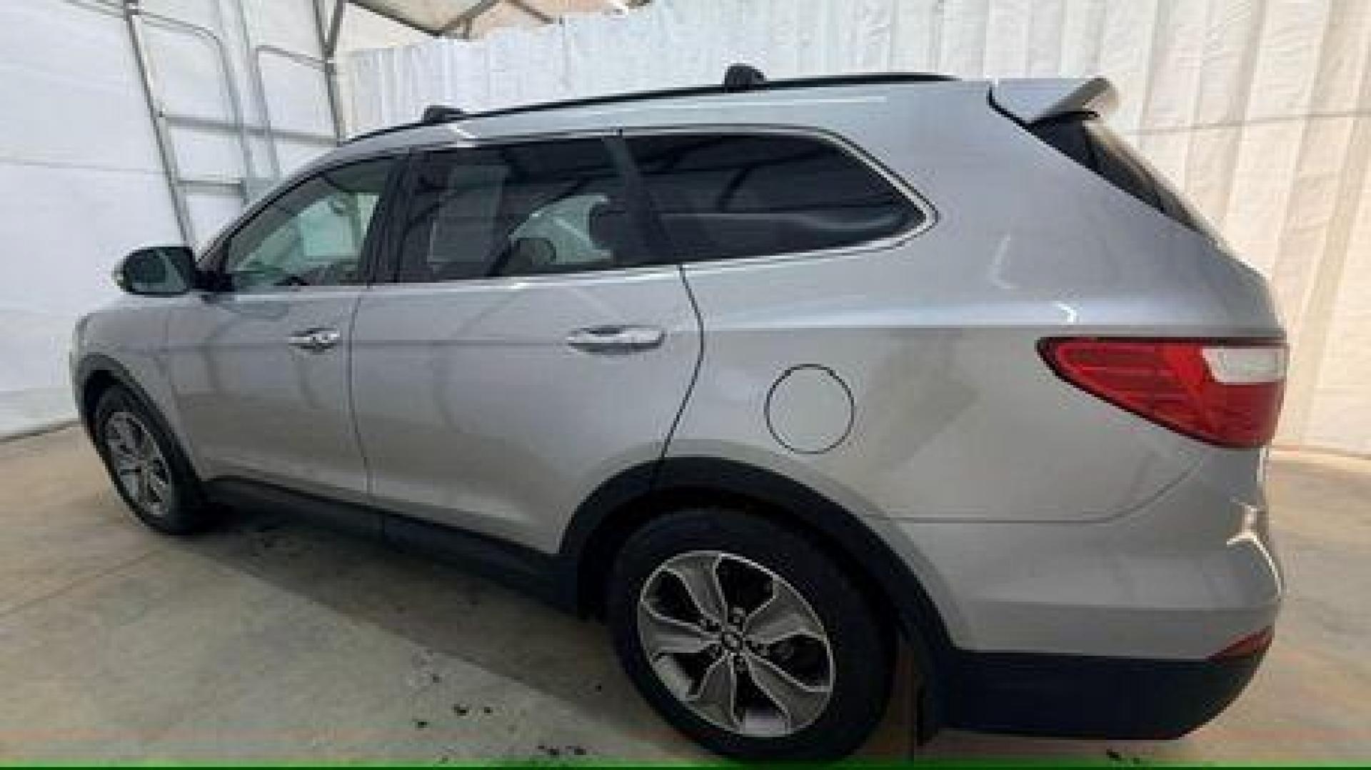 2014 Silver Hyundai Santa Fe GLS (KM8SN4HF3EU) with an Lambda II 3.3L V-6 gasoline direct injection engine, located at 1806 Veterans Memorial Hwy SW, Austell, GA, 30168, (770) 944-9558, 33.817959, -84.606987 - Photo#2