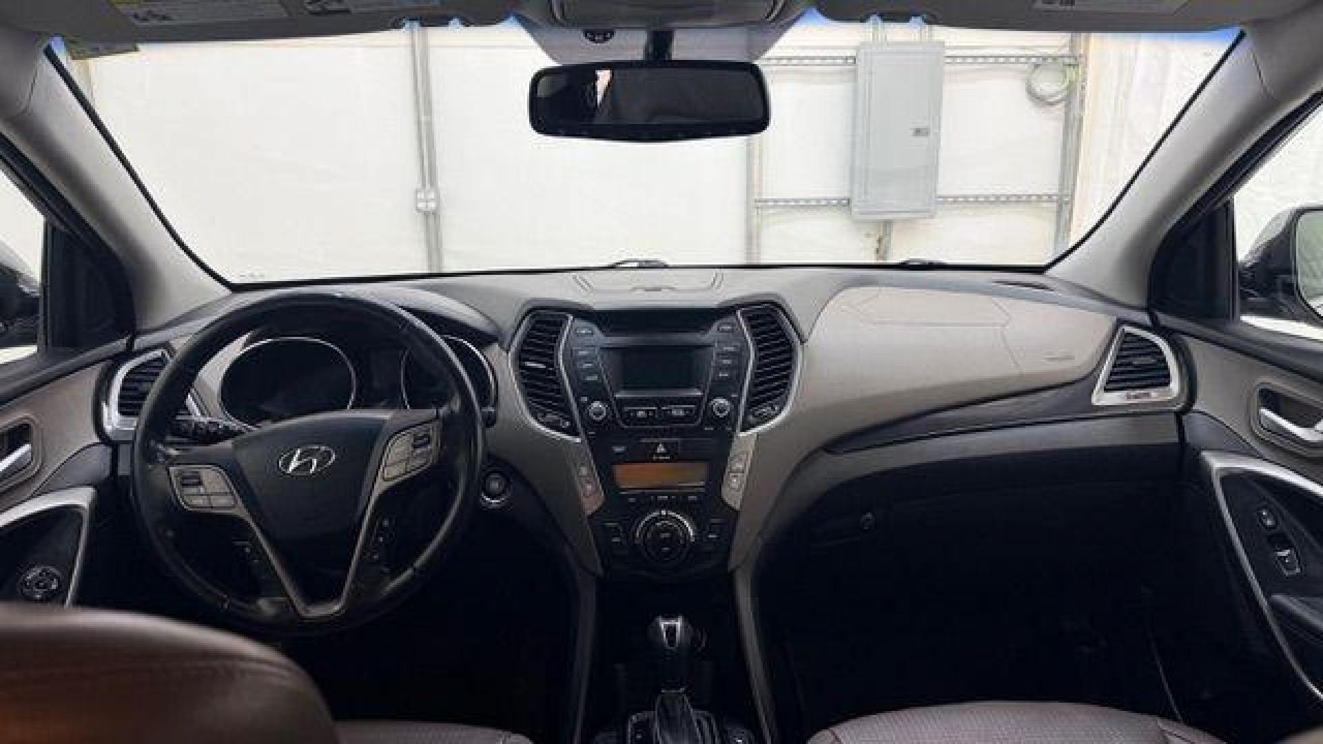 2014 Silver Hyundai Santa Fe GLS (KM8SN4HF3EU) with an Lambda II 3.3L V-6 gasoline direct injection engine, located at 1806 Veterans Memorial Hwy SW, Austell, GA, 30168, (770) 944-9558, 33.817959, -84.606987 - Photo#16