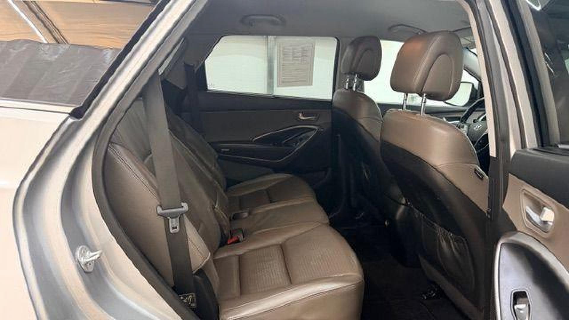 2014 Silver Hyundai Santa Fe GLS (KM8SN4HF3EU) with an Lambda II 3.3L V-6 gasoline direct injection engine, located at 1806 Veterans Memorial Hwy SW, Austell, GA, 30168, (770) 944-9558, 33.817959, -84.606987 - Photo#17