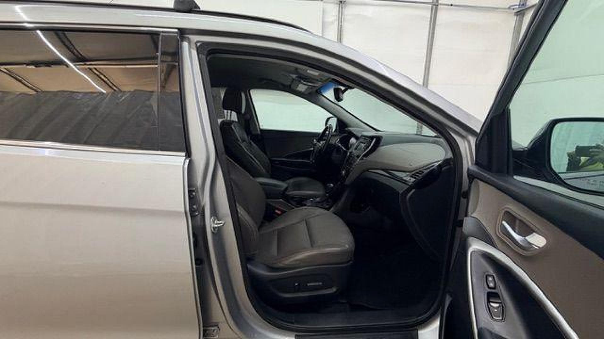 2014 Silver Hyundai Santa Fe GLS (KM8SN4HF3EU) with an Lambda II 3.3L V-6 gasoline direct injection engine, located at 1806 Veterans Memorial Hwy SW, Austell, GA, 30168, (770) 944-9558, 33.817959, -84.606987 - Photo#18