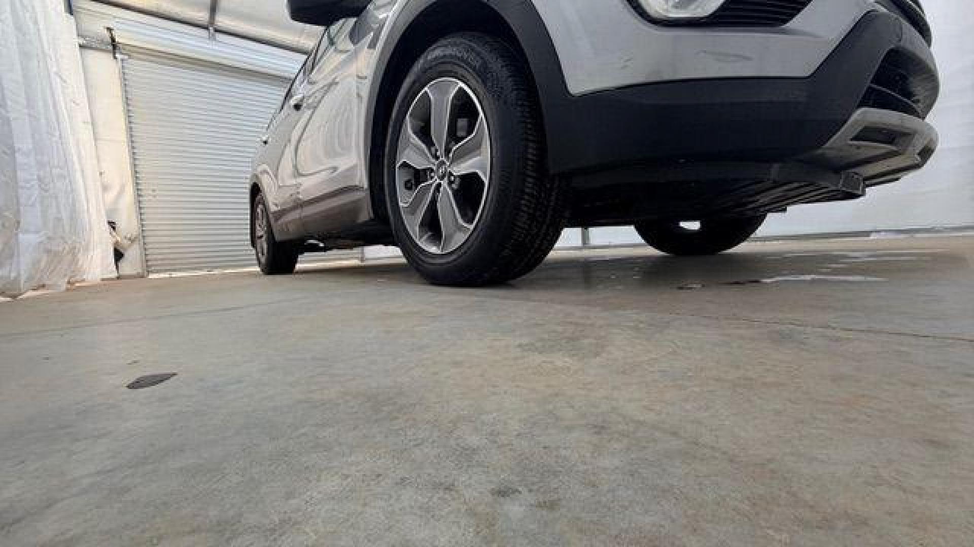 2014 Silver Hyundai Santa Fe GLS (KM8SN4HF3EU) with an Lambda II 3.3L V-6 gasoline direct injection engine, located at 1806 Veterans Memorial Hwy SW, Austell, GA, 30168, (770) 944-9558, 33.817959, -84.606987 - Photo#19