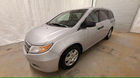 2013 Silver Honda Odyssey LX (5FNRL5H24DB) with an 3.5L V-6 i-VTEC variable valve control engine, located at 1806 Veterans Memorial Hwy SW, Austell, GA, 30168, (770) 944-9558, 33.817959, -84.606987 - Photo#1
