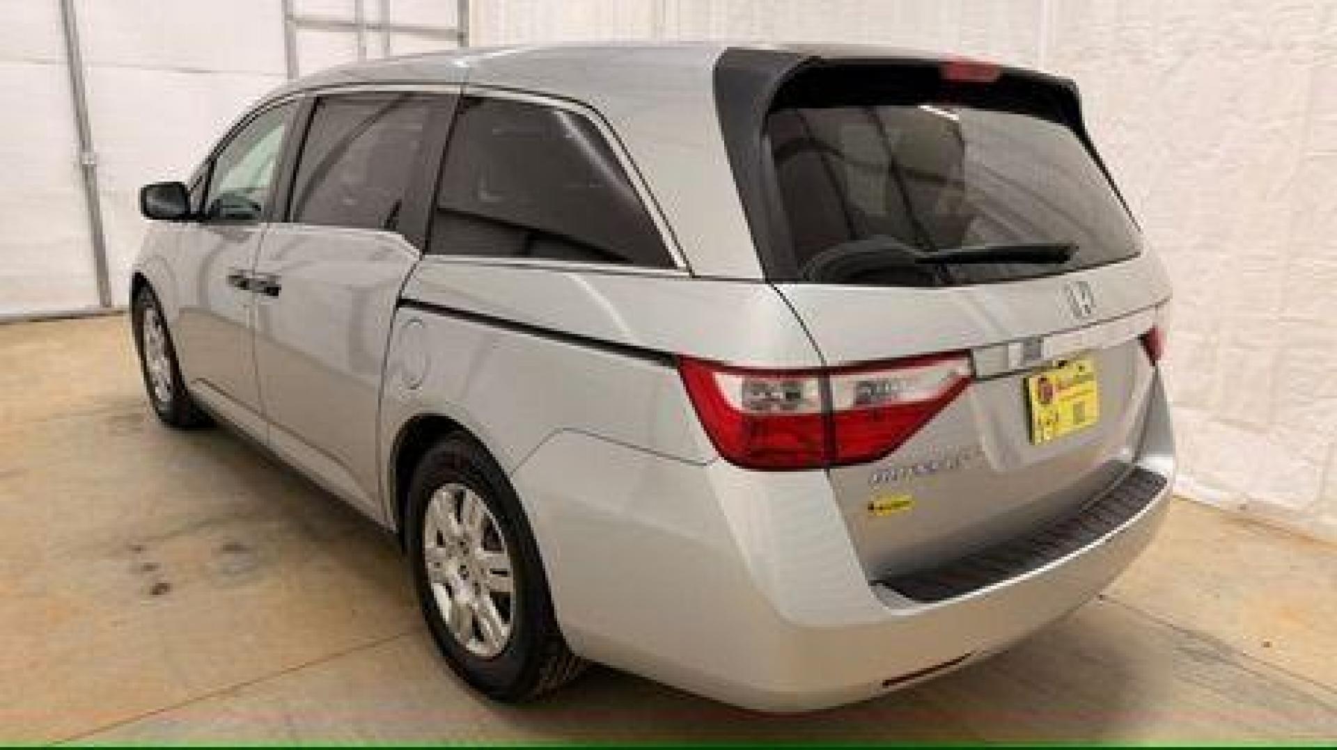 2013 Silver Honda Odyssey LX (5FNRL5H24DB) with an 3.5L V-6 i-VTEC variable valve control engine, located at 1806 Veterans Memorial Hwy SW, Austell, GA, 30168, (770) 944-9558, 33.817959, -84.606987 - Photo#3