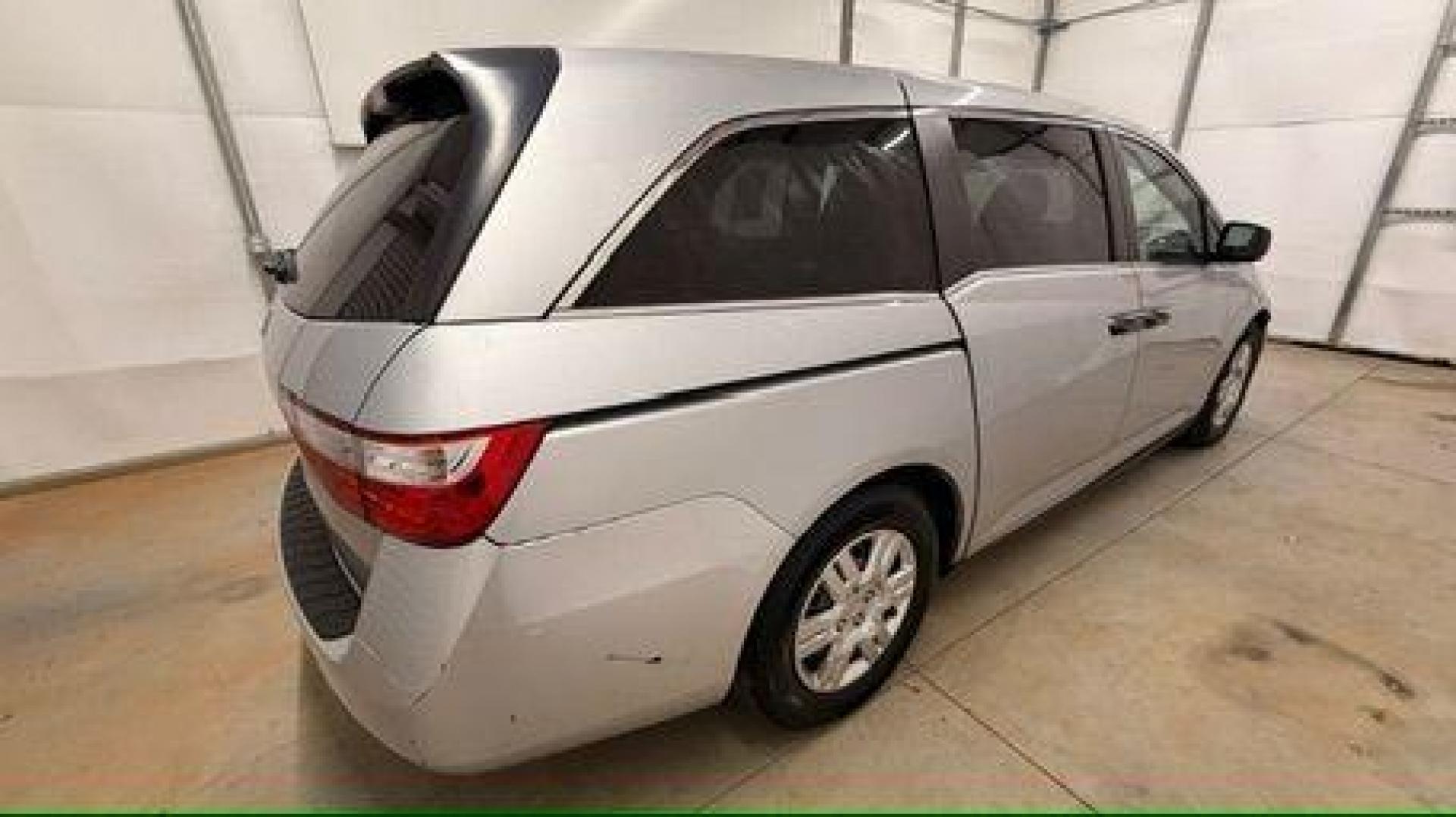 2013 Silver Honda Odyssey LX (5FNRL5H24DB) with an 3.5L V-6 i-VTEC variable valve control engine, located at 1806 Veterans Memorial Hwy SW, Austell, GA, 30168, (770) 944-9558, 33.817959, -84.606987 - Photo#6
