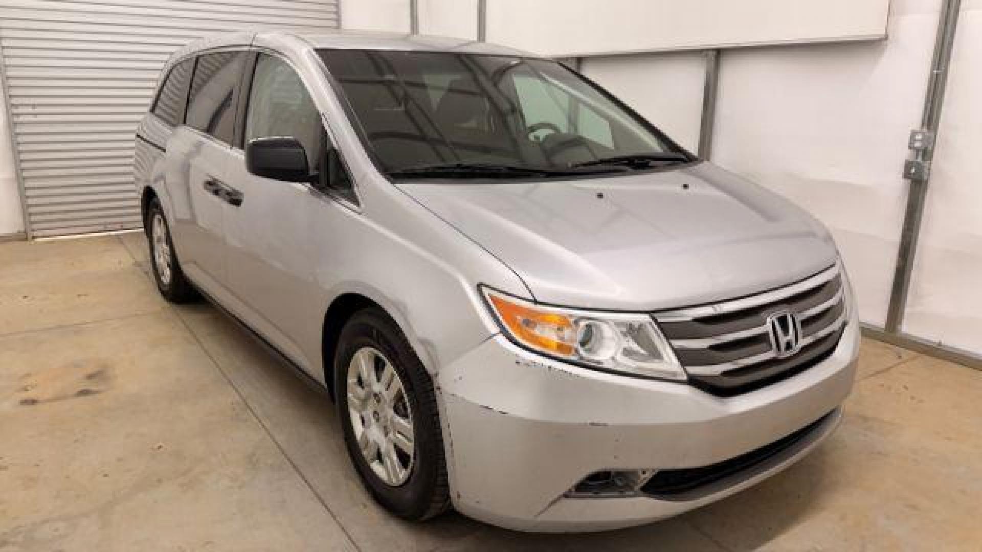 2013 Silver Honda Odyssey LX (5FNRL5H24DB) with an 3.5L V-6 i-VTEC variable valve control engine, located at 1806 Veterans Memorial Hwy SW, Austell, GA, 30168, (770) 944-9558, 33.817959, -84.606987 - Photo#8