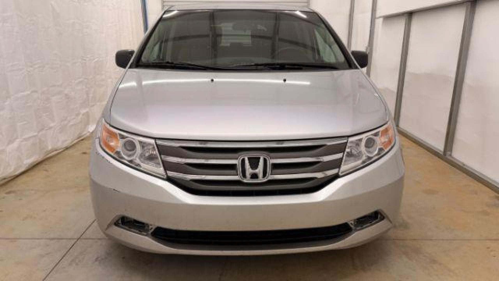 2013 Silver Honda Odyssey LX (5FNRL5H24DB) with an 3.5L V-6 i-VTEC variable valve control engine, located at 1806 Veterans Memorial Hwy SW, Austell, GA, 30168, (770) 944-9558, 33.817959, -84.606987 - Photo#9