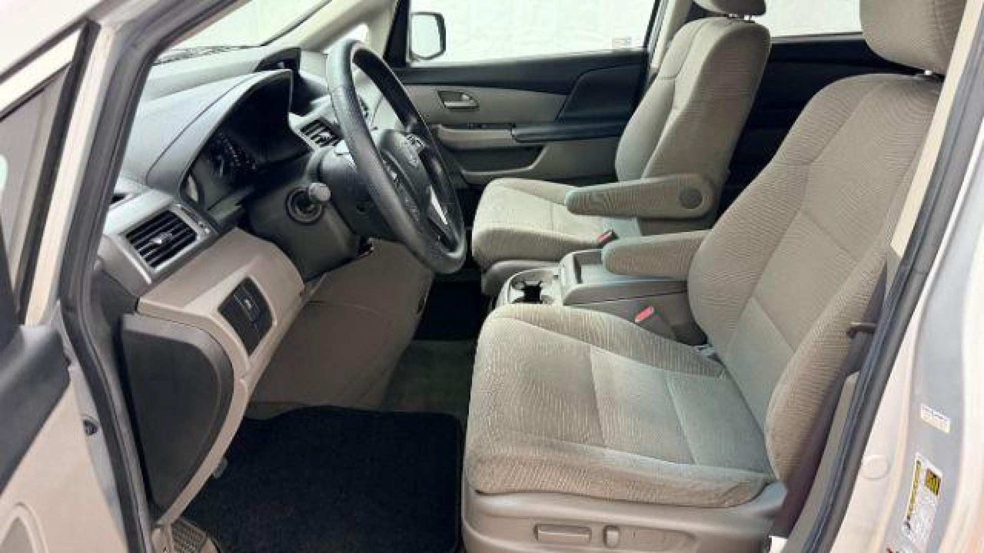 2013 Silver Honda Odyssey LX (5FNRL5H24DB) with an 3.5L V-6 i-VTEC variable valve control engine, located at 1806 Veterans Memorial Hwy SW, Austell, GA, 30168, (770) 944-9558, 33.817959, -84.606987 - Photo#11