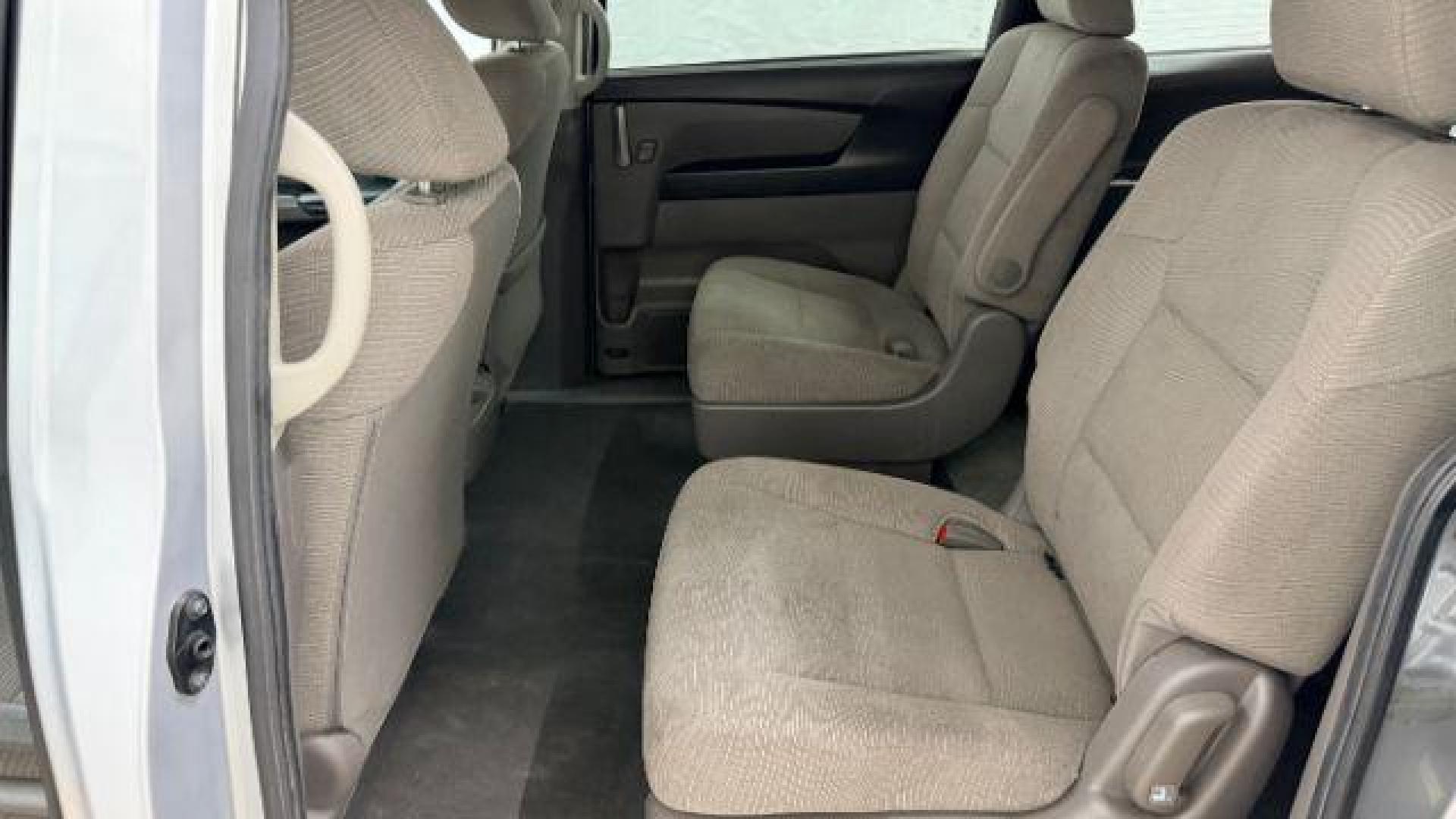 2013 Silver Honda Odyssey LX (5FNRL5H24DB) with an 3.5L V-6 i-VTEC variable valve control engine, located at 1806 Veterans Memorial Hwy SW, Austell, GA, 30168, (770) 944-9558, 33.817959, -84.606987 - Photo#12