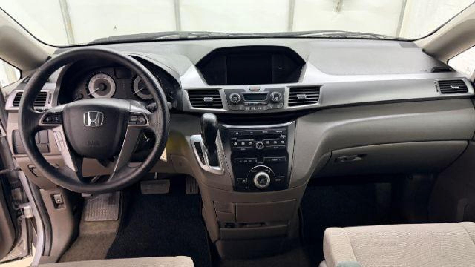 2013 Silver Honda Odyssey LX (5FNRL5H24DB) with an 3.5L V-6 i-VTEC variable valve control engine, located at 1806 Veterans Memorial Hwy SW, Austell, GA, 30168, (770) 944-9558, 33.817959, -84.606987 - Photo#13