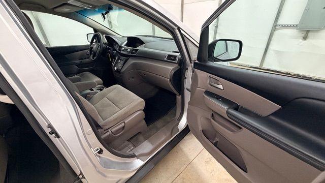 2013 Silver Honda Odyssey LX (5FNRL5H24DB) with an 3.5L V-6 i-VTEC variable valve control engine, located at 1806 Veterans Memorial Hwy SW, Austell, GA, 30168, (770) 944-9558, 33.817959, -84.606987 - Photo#15