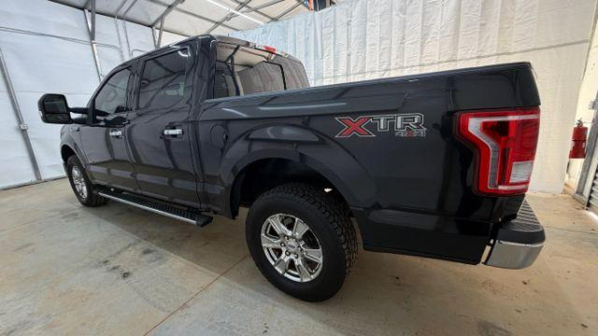 2015 Black Ford F-150 XLT (1FTEW1EG9FF) with an EcoBoost 3.5L V-6 gasoline direct injection engine, located at 1806 Veterans Memorial Hwy SW, Austell, GA, 30168, (770) 944-9558, 33.817959, -84.606987 - Photo#2