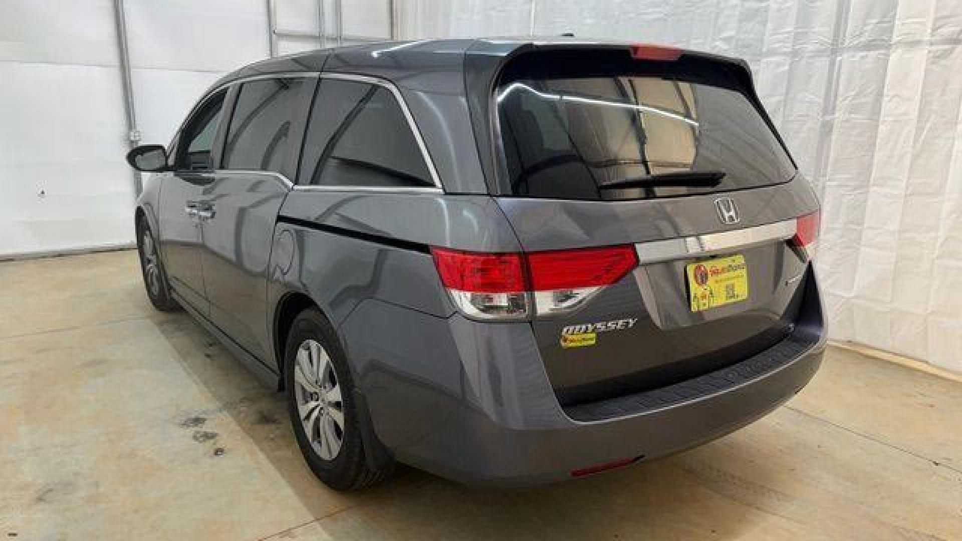 2016 Gray Honda Odyssey SE (5FNRL5H32GB) with an 3.5L V-6 i-VTEC variable valve control engine, located at 1806 Veterans Memorial Hwy SW, Austell, GA, 30168, (770) 944-9558, 33.817959, -84.606987 - Photo#2