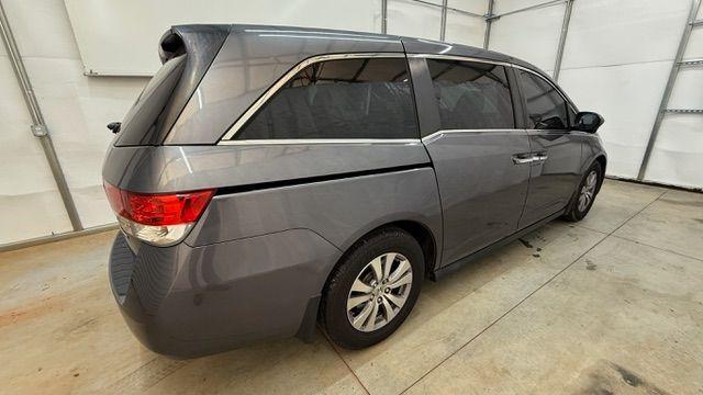 2016 Gray Honda Odyssey SE (5FNRL5H32GB) with an 3.5L V-6 i-VTEC variable valve control engine, located at 1806 Veterans Memorial Hwy SW, Austell, GA, 30168, (770) 944-9558, 33.817959, -84.606987 - Photo#5