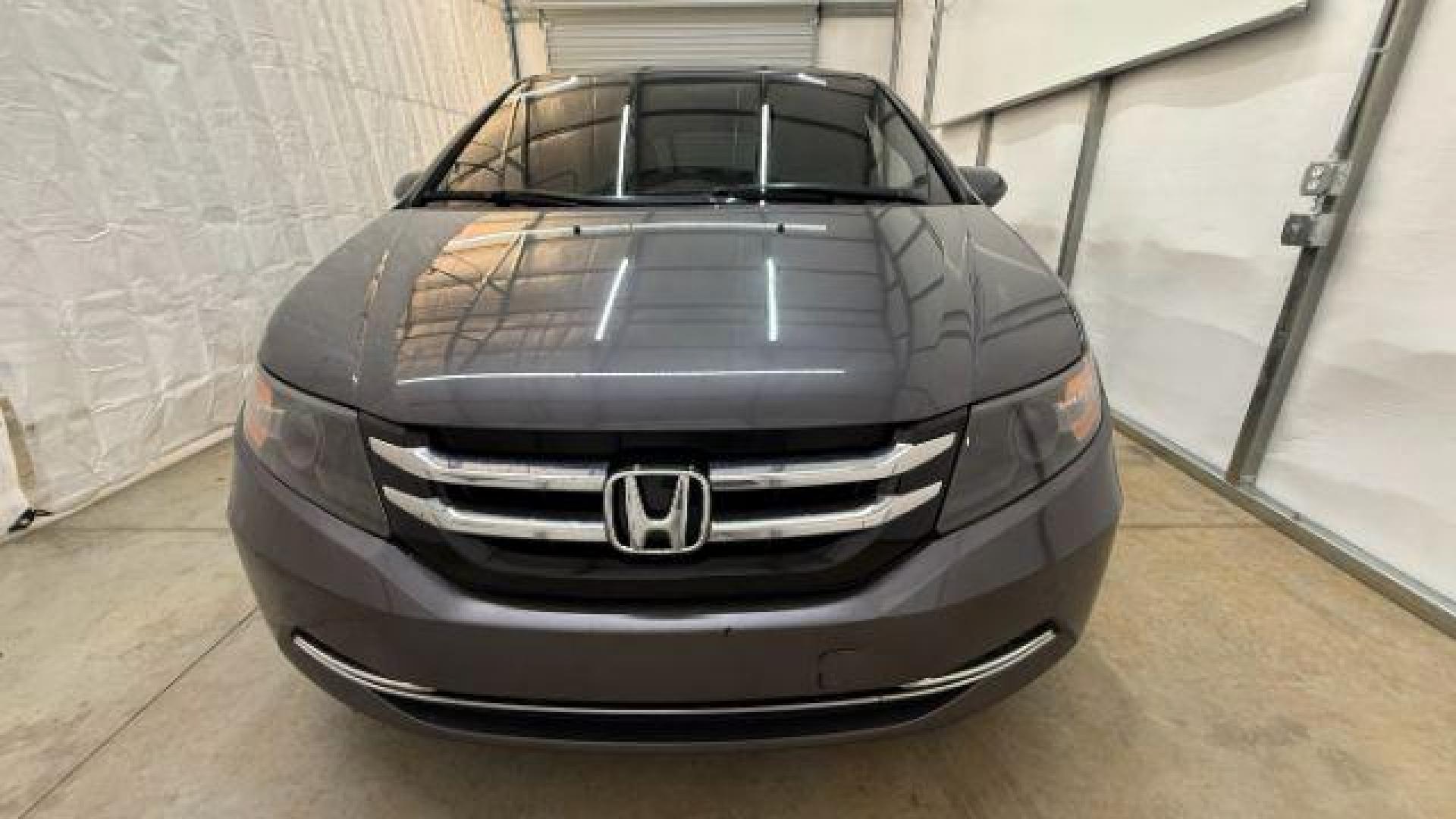 2016 Gray Honda Odyssey SE (5FNRL5H32GB) with an 3.5L V-6 i-VTEC variable valve control engine, located at 1806 Veterans Memorial Hwy SW, Austell, GA, 30168, (770) 944-9558, 33.817959, -84.606987 - Photo#9