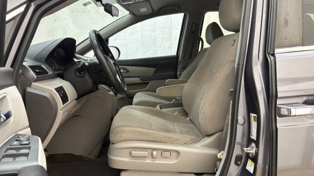 2016 Gray Honda Odyssey SE (5FNRL5H32GB) with an 3.5L V-6 i-VTEC variable valve control engine, located at 1806 Veterans Memorial Hwy SW, Austell, GA, 30168, (770) 944-9558, 33.817959, -84.606987 - Photo#11
