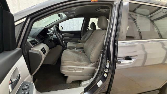 2016 Gray Honda Odyssey SE (5FNRL5H32GB) with an 3.5L V-6 i-VTEC variable valve control engine, located at 1806 Veterans Memorial Hwy SW, Austell, GA, 30168, (770) 944-9558, 33.817959, -84.606987 - Photo#12