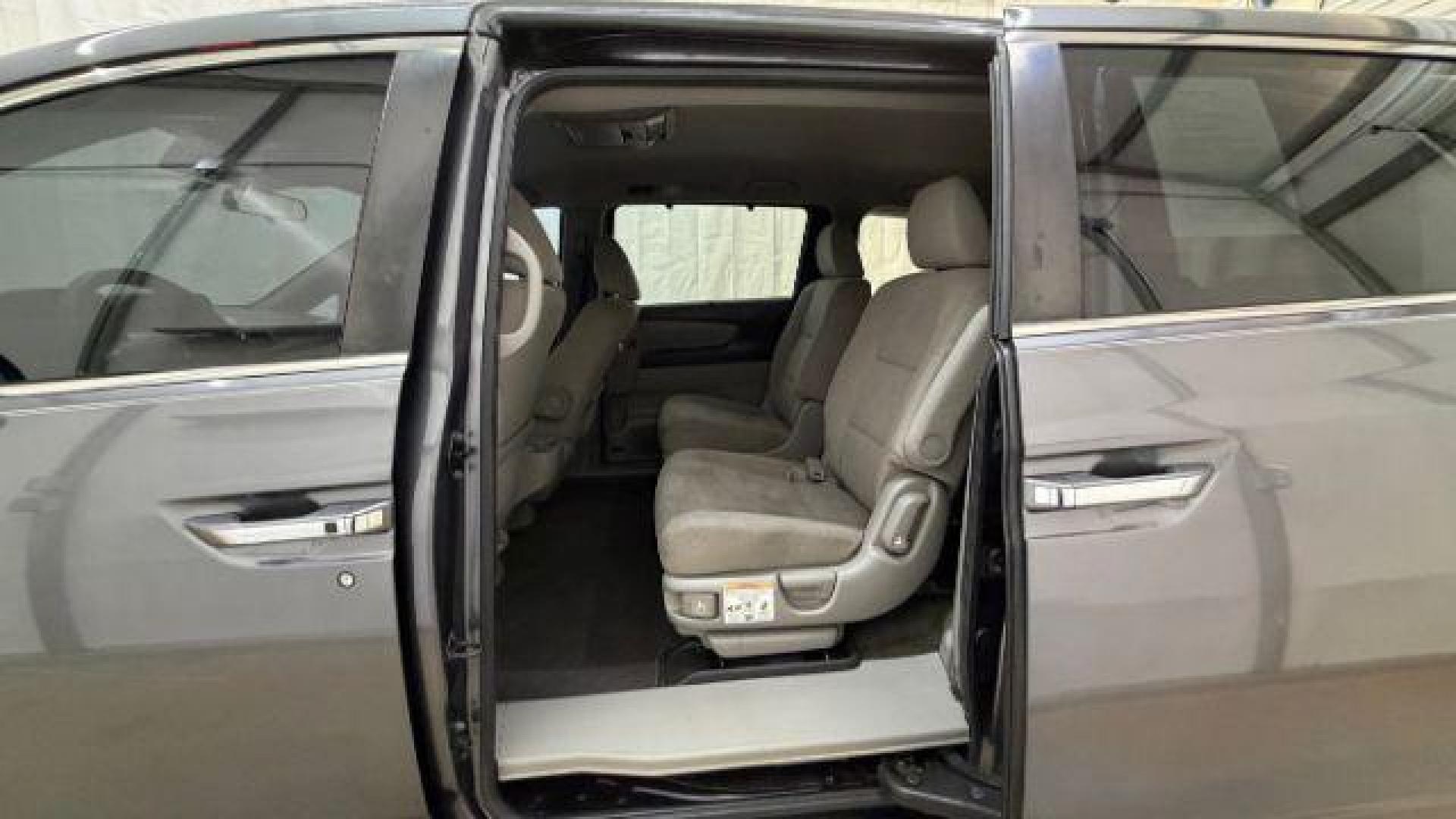 2016 Gray Honda Odyssey SE (5FNRL5H32GB) with an 3.5L V-6 i-VTEC variable valve control engine, located at 1806 Veterans Memorial Hwy SW, Austell, GA, 30168, (770) 944-9558, 33.817959, -84.606987 - Photo#13