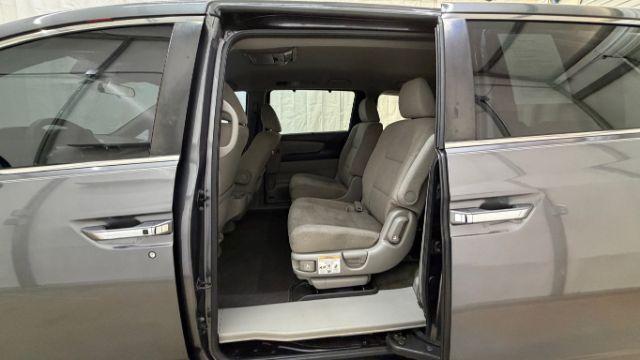 2016 Gray Honda Odyssey SE (5FNRL5H32GB) with an 3.5L V-6 i-VTEC variable valve control engine, located at 1806 Veterans Memorial Hwy SW, Austell, GA, 30168, (770) 944-9558, 33.817959, -84.606987 - Photo#13