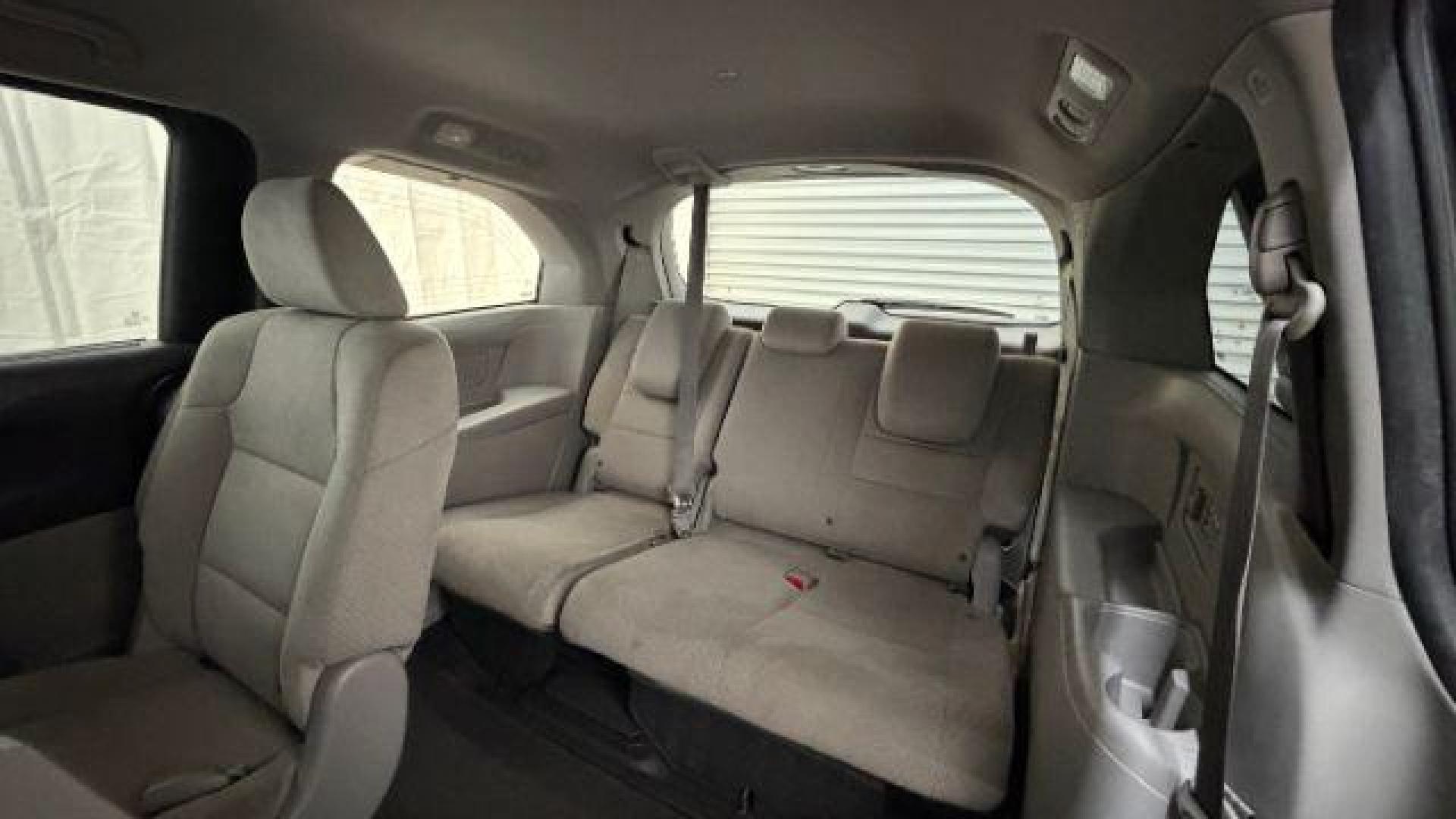 2016 Gray Honda Odyssey SE (5FNRL5H32GB) with an 3.5L V-6 i-VTEC variable valve control engine, located at 1806 Veterans Memorial Hwy SW, Austell, GA, 30168, (770) 944-9558, 33.817959, -84.606987 - Photo#14