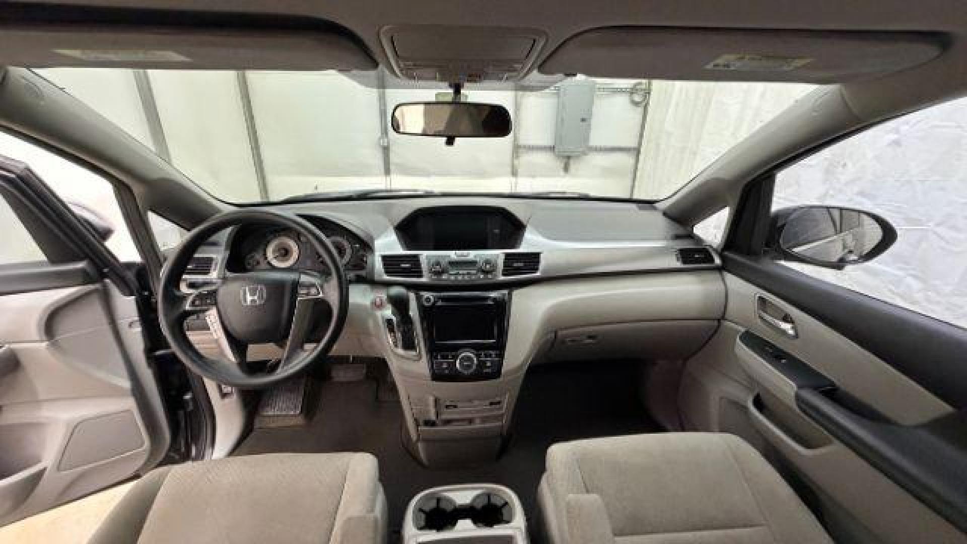 2016 Gray Honda Odyssey SE (5FNRL5H32GB) with an 3.5L V-6 i-VTEC variable valve control engine, located at 1806 Veterans Memorial Hwy SW, Austell, GA, 30168, (770) 944-9558, 33.817959, -84.606987 - Photo#15