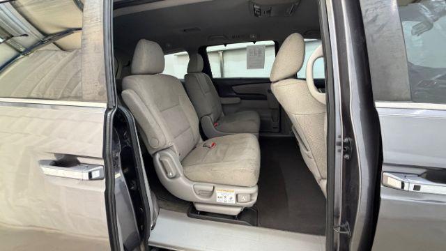 2016 Gray Honda Odyssey SE (5FNRL5H32GB) with an 3.5L V-6 i-VTEC variable valve control engine, located at 1806 Veterans Memorial Hwy SW, Austell, GA, 30168, (770) 944-9558, 33.817959, -84.606987 - Photo#17
