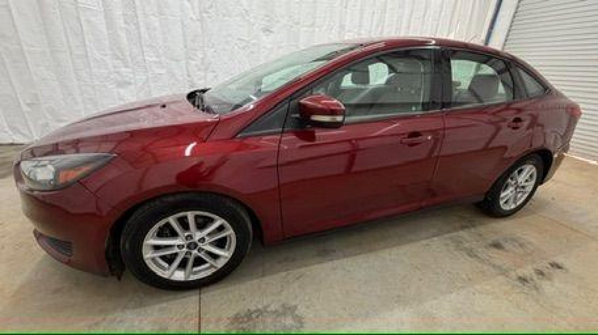 2016 Red Ford Focus SE (1FADP3F21GL) , located at 1806 Veterans Memorial Hwy SW, Austell, GA, 30168, (770) 944-9558, 33.817959, -84.606987 - Photo#1