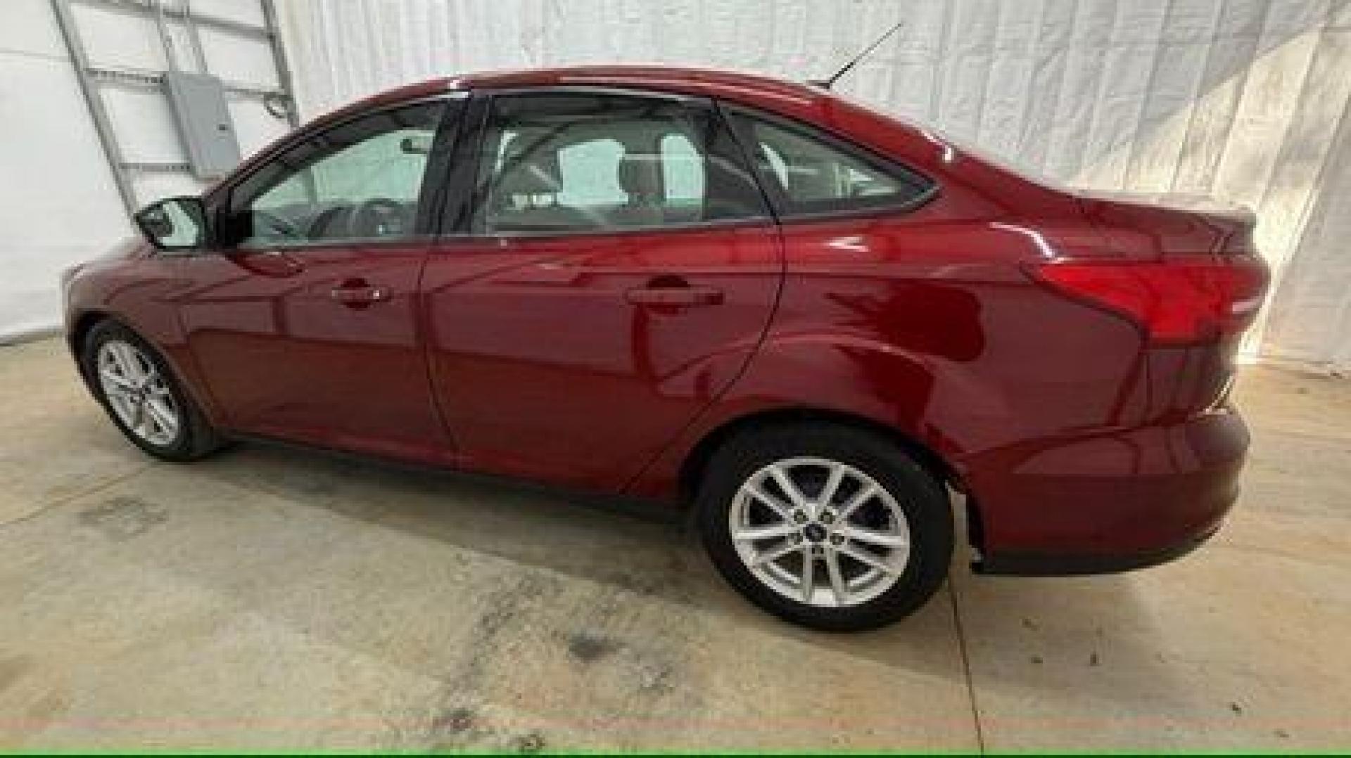 2016 Red Ford Focus SE (1FADP3F21GL) , located at 1806 Veterans Memorial Hwy SW, Austell, GA, 30168, (770) 944-9558, 33.817959, -84.606987 - Photo#2