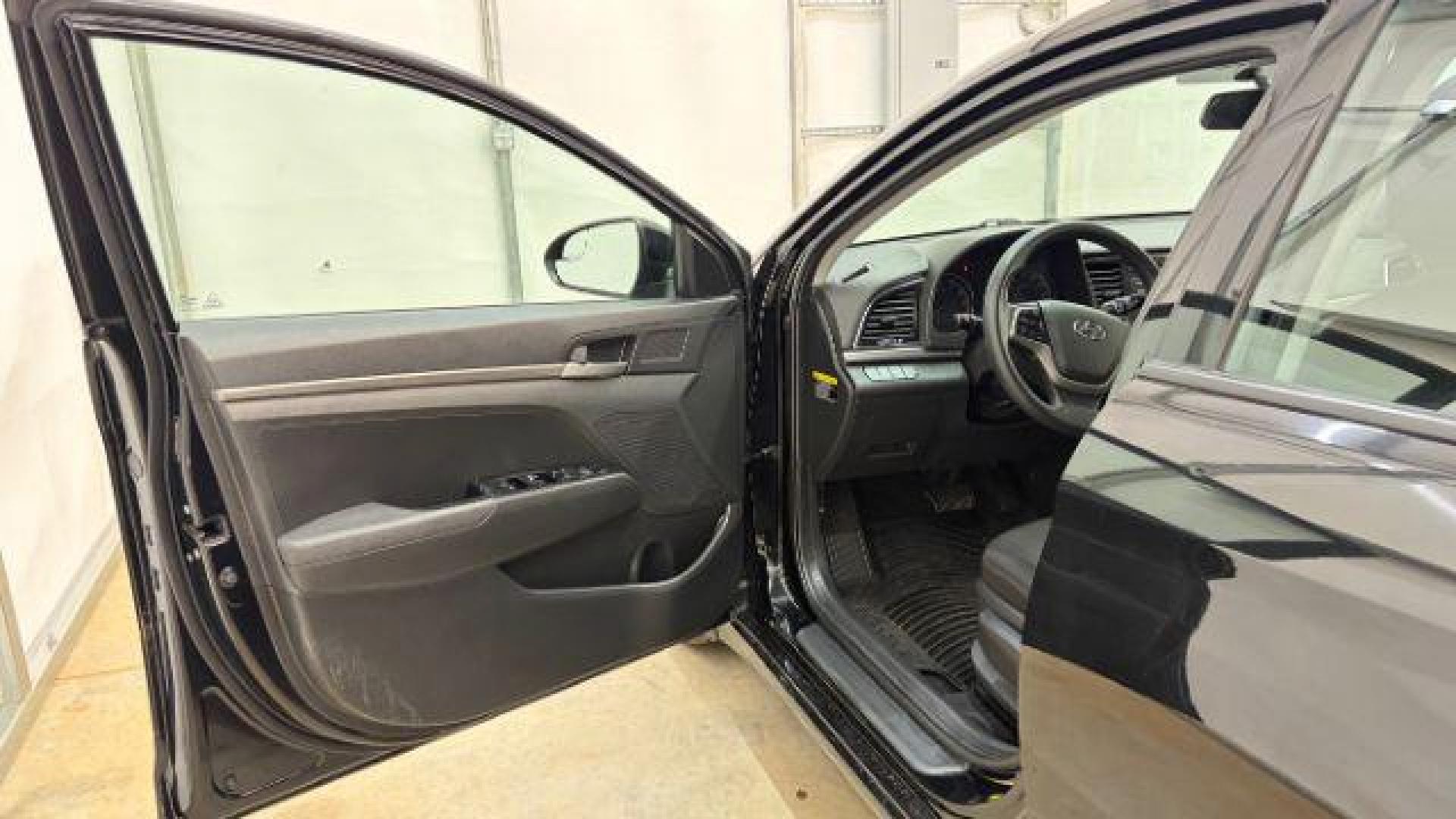 2018 Black Hyundai Elantra SE (5NPD74LF1JH) with an Nu 2L I-4 DOHC engine, located at 1806 Veterans Memorial Hwy SW, Austell, GA, 30168, (770) 944-9558, 33.817959, -84.606987 - Photo#9