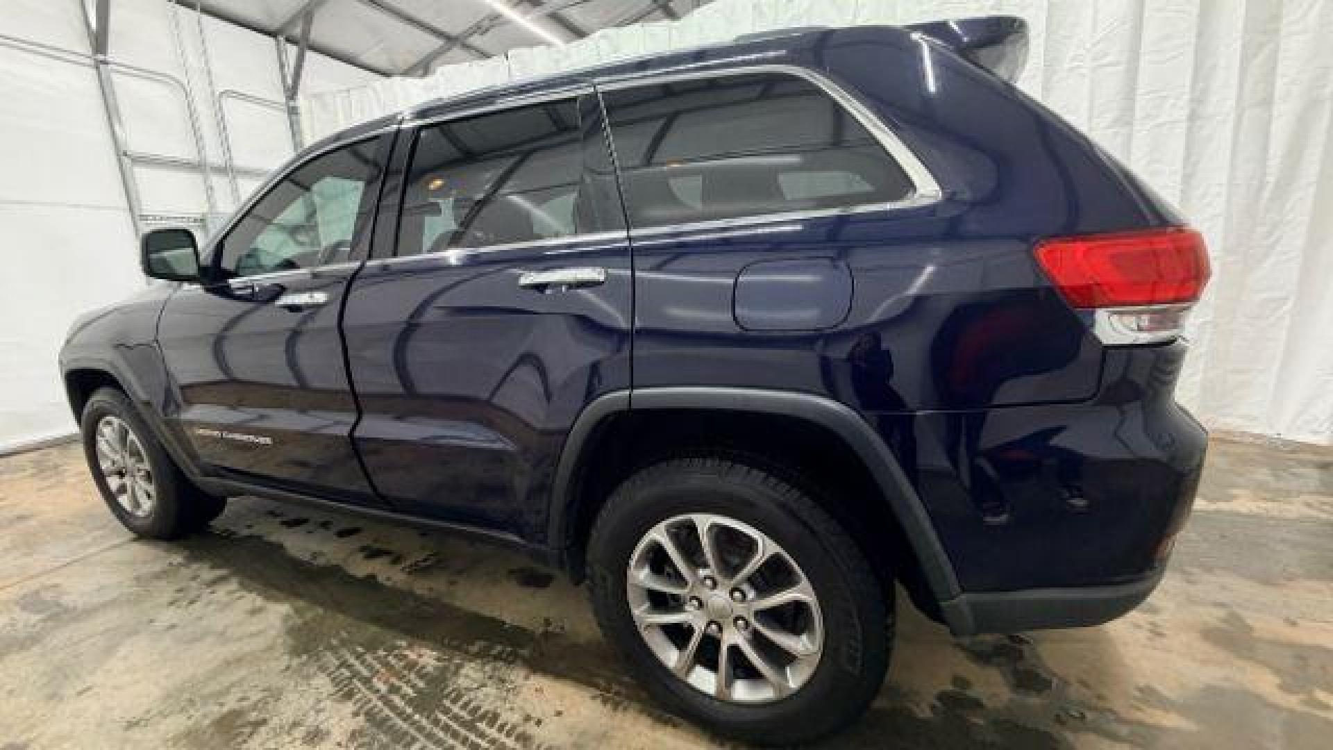 2015 Blue Jeep Grand Cherokee Limited (1C4RJEBG4FC) with an 3.6L V-6 DOHC engine, located at 1806 Veterans Memorial Hwy SW, Austell, GA, 30168, (770) 944-9558, 33.817959, -84.606987 - Photo#2
