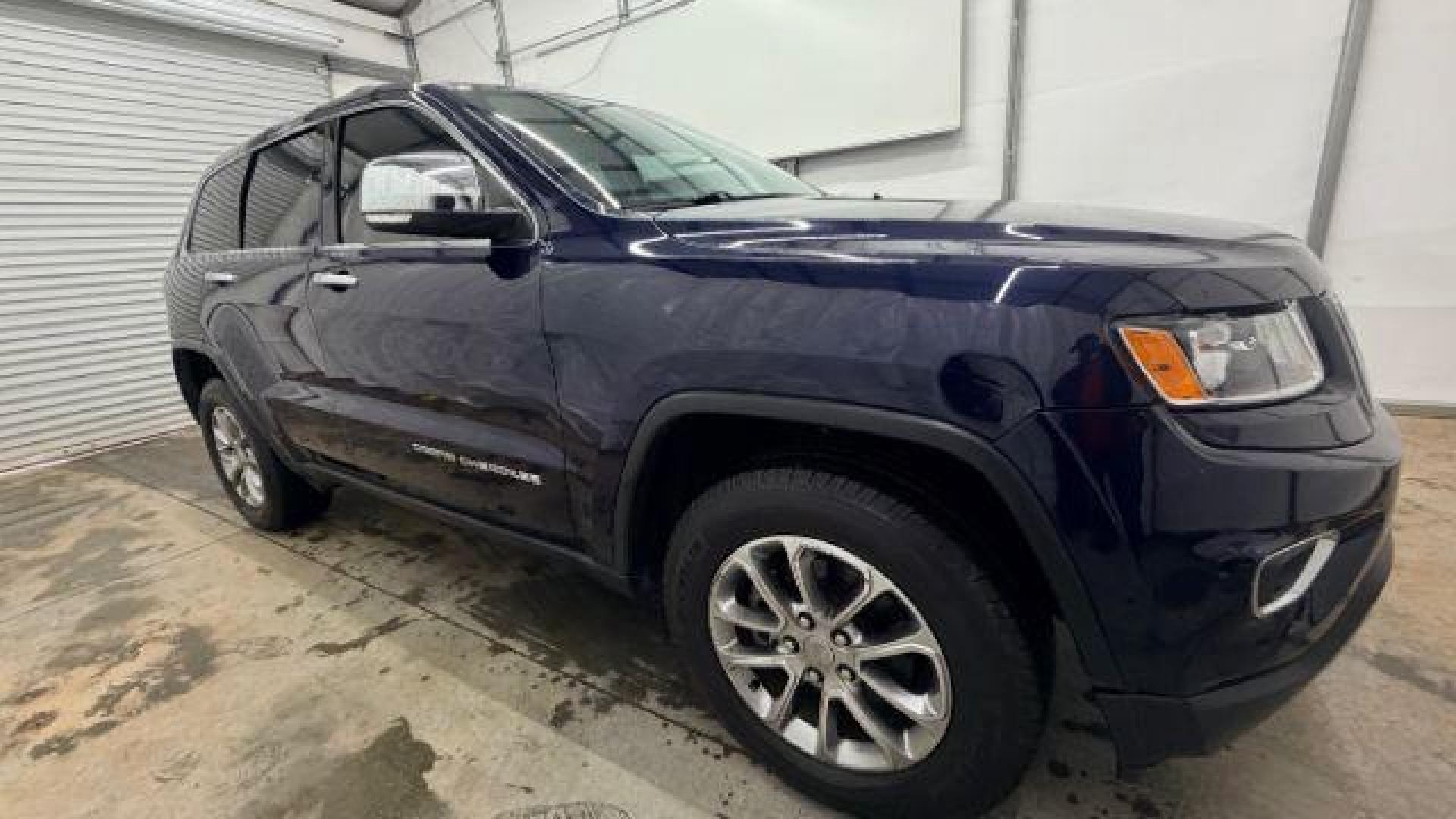 2015 Blue Jeep Grand Cherokee Limited (1C4RJEBG4FC) with an 3.6L V-6 DOHC engine, located at 1806 Veterans Memorial Hwy SW, Austell, GA, 30168, (770) 944-9558, 33.817959, -84.606987 - Photo#7