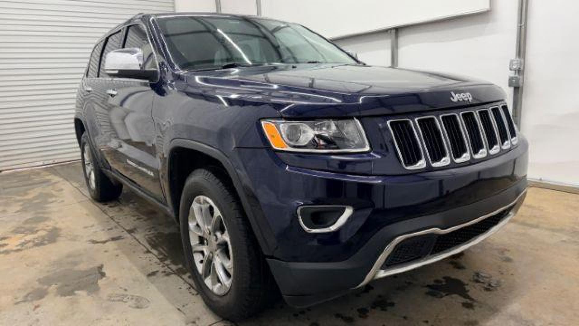 2015 Blue Jeep Grand Cherokee Limited (1C4RJEBG4FC) with an 3.6L V-6 DOHC engine, located at 1806 Veterans Memorial Hwy SW, Austell, GA, 30168, (770) 944-9558, 33.817959, -84.606987 - Photo#8