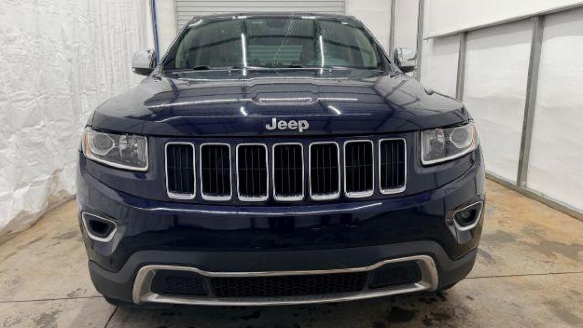 2015 Blue Jeep Grand Cherokee Limited (1C4RJEBG4FC) with an 3.6L V-6 DOHC engine, located at 1806 Veterans Memorial Hwy SW, Austell, GA, 30168, (770) 944-9558, 33.817959, -84.606987 - Photo#9
